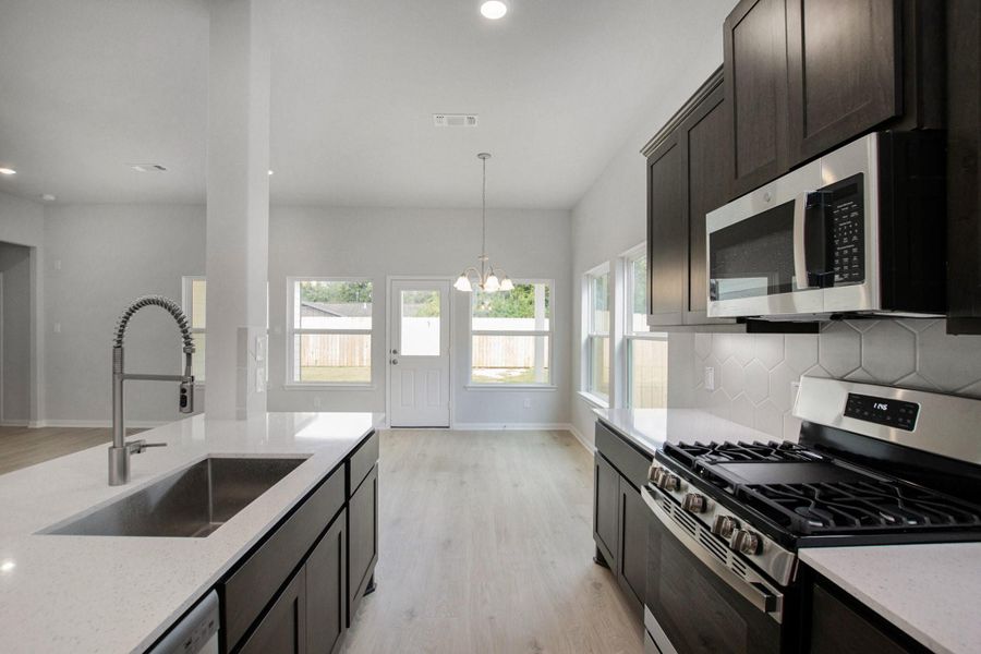 42" Gray Wolf Cabinetry with Quartz Countertops
