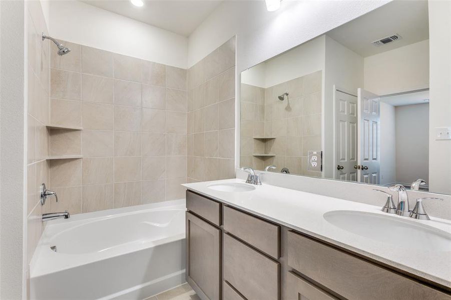 Full bathroom with shower / tub combination and double vanity Full bathroom with shower / tub combination and double vanity