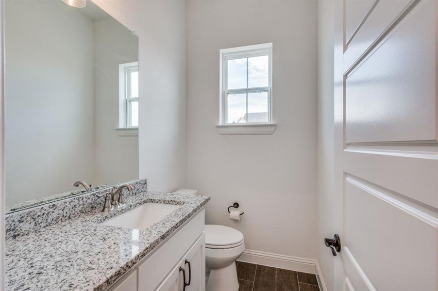 Bathroom with vanity and toilet