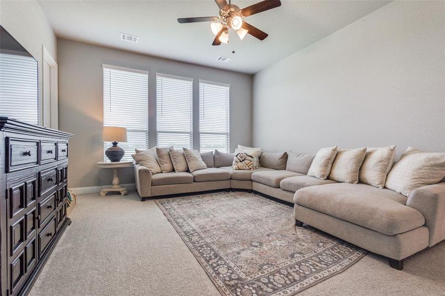 Cozy and inviting family room designed for comfort, with plenty of space to gather, relax, and enjoy quality time together.