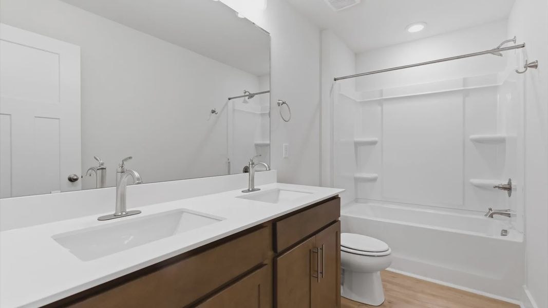 Well-appointed full bath with high standards of craftsmanship and everyday function at the Pelham Crossing community
