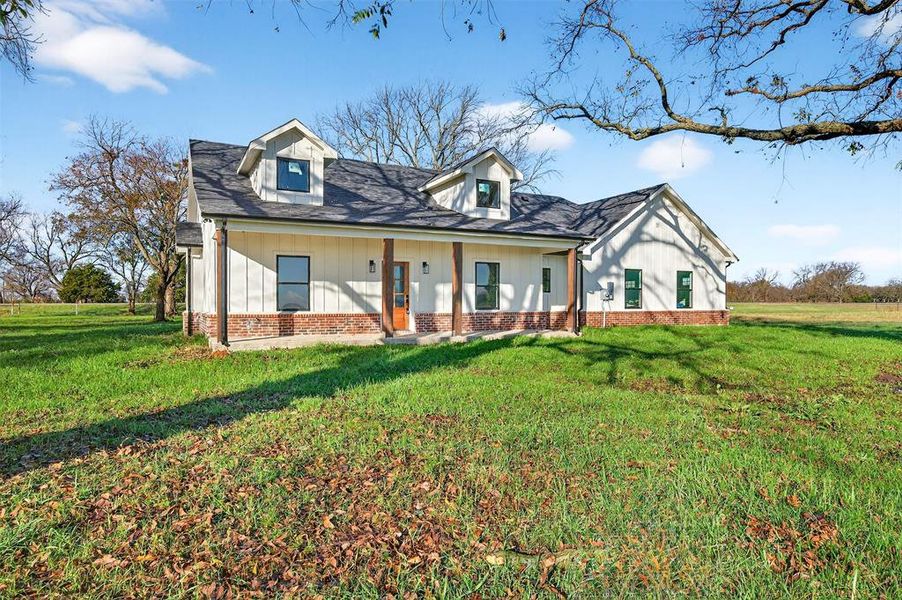 Front exterior of a new home in , Whitesboro, TX, highlighting curb appeal (Image 1). Front exterior of a new home in , Whitesboro, TX, highlighting curb appeal (Image 1).
