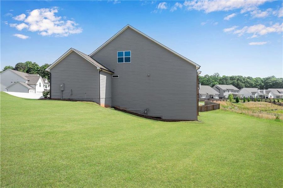 Exterior details and patio area of a home in Hidden Fields, Hoschton (Image 4).
