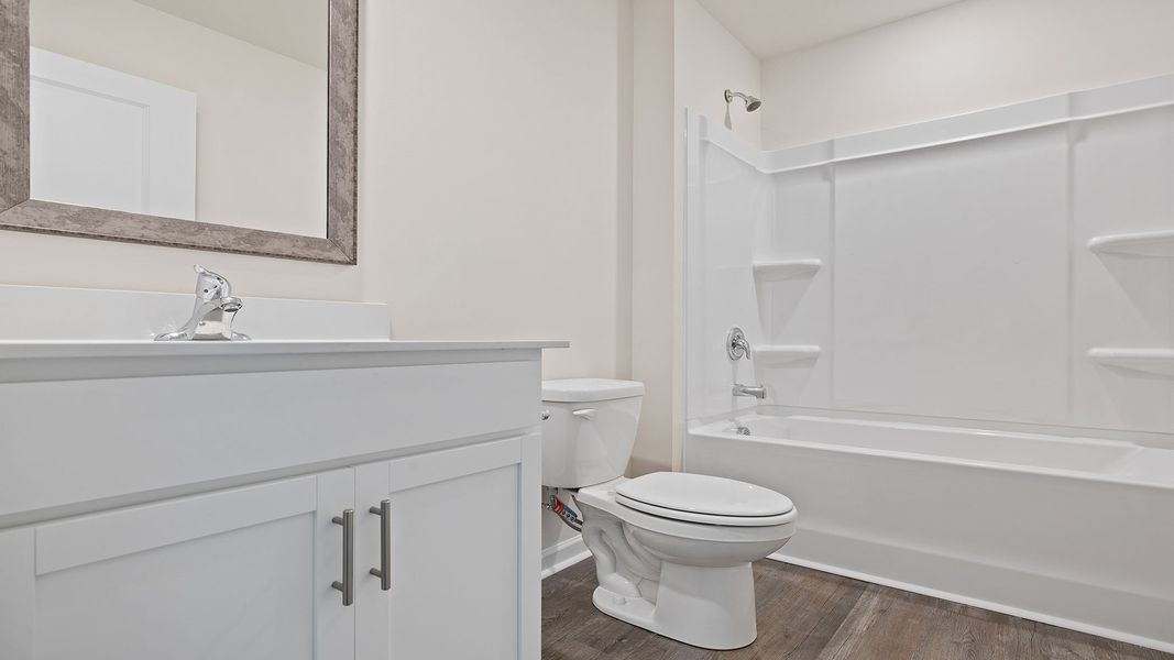 Furnished interior view inside a new home in Bentley Park, Greenwood (Image 3).