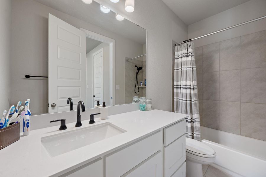 Furnished interior view inside a new home in 6 Creeks, Kyle (Image 11). Furnished interior view inside a new home in 6 Creeks, Kyle (Image 11).