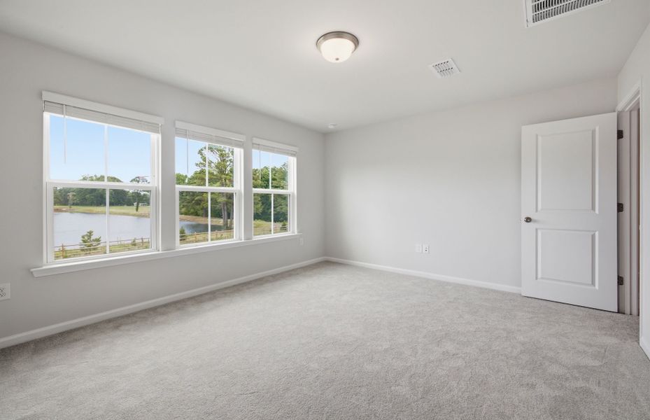 Spacious, unfurnished interior of a new home in Saunders Farm, Willow Spring (Image 26).