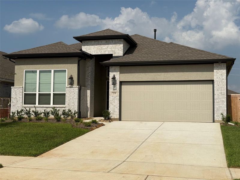 Front exterior of a new home in Wood Leaf Reserve, Tomball, TX, highlighting curb appeal (Image 2).