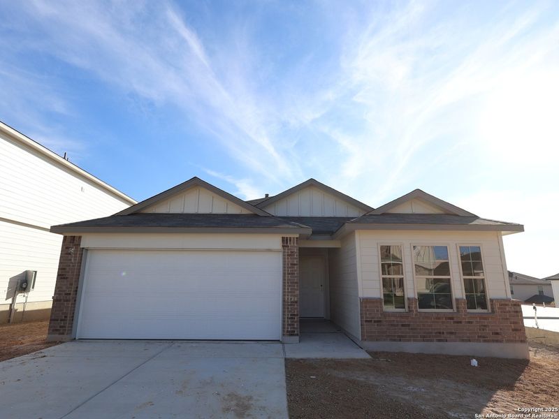 Front exterior of a new home in Hunters Ranch, San Antonio, TX, highlighting curb appeal (Image 19).