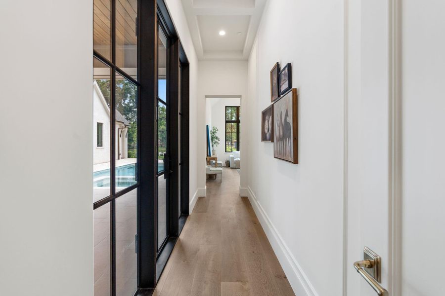 Entry into the primary was intentionally planned to ensure privacy, maximize natural light, and have a functional space