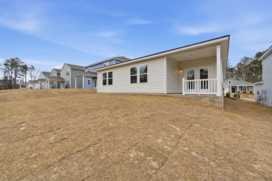 Exterior details and patio area of a home in Grand Arbor, Blythewood (Image 18).
