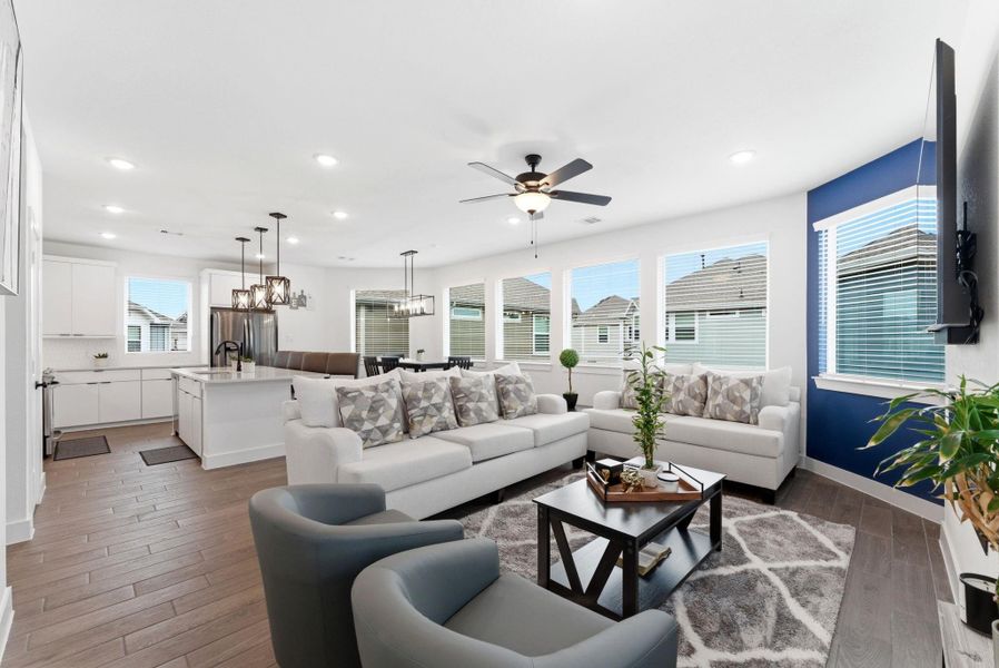 Bright and inviting living room with abundant natural light and an open layout ideal for gatherings and relaxation.