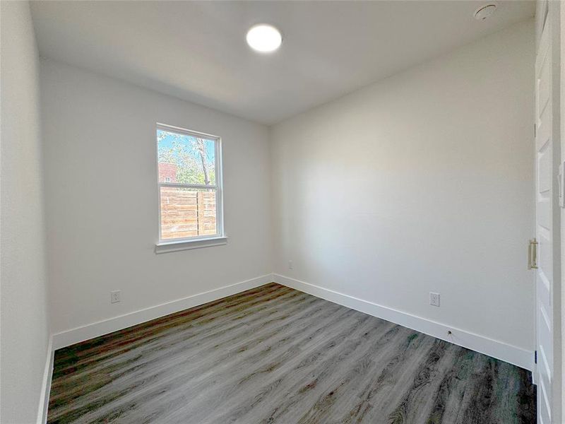 Empty room featuring hardwood / wood-style floors