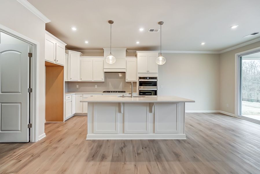 Kitchen with island breakfast bar