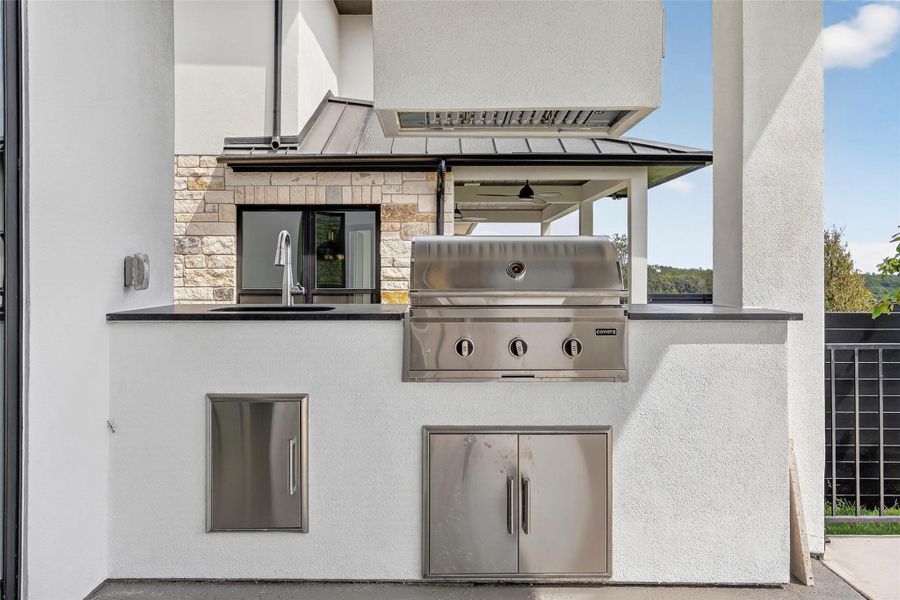 Exterior details and patio area of a home in Milky Way at River Place, Austin (Image 27).