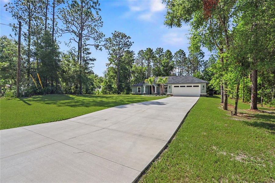 Front exterior of a new home in , Dunnellon, FL, highlighting curb appeal (Image 31).