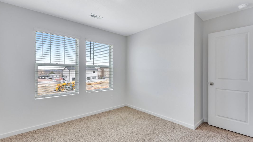 Representative unfurnished interior of a home built from the Juniper by D.R. Horton in Ellston Park, Colorado Springs (Image 29).