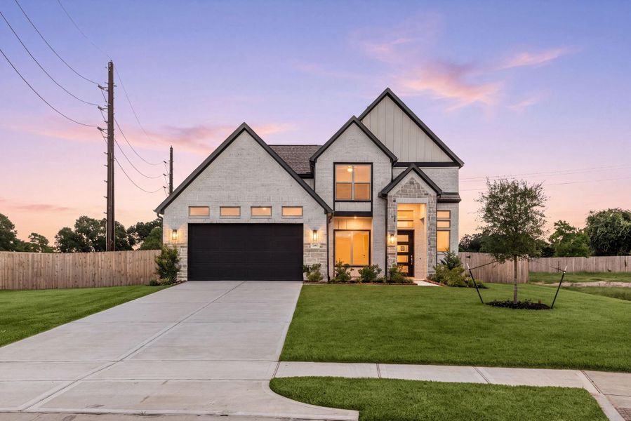 he sun setting behind 349 Covey Ln highlights the home's crisp white brick, stone accents, and board-and-batten gables. Warm light pours from the two-story windows and glass front door, giving the whole facade a lived-in glow before you've even stepped inside. he sun setting behind 349 Covey Ln highlights the home's crisp white brick, stone accents, and board-and-batten gables. Warm light pours from the two-story windows and glass front door, giving the whole facade a lived-in glow before you've even stepped inside.
