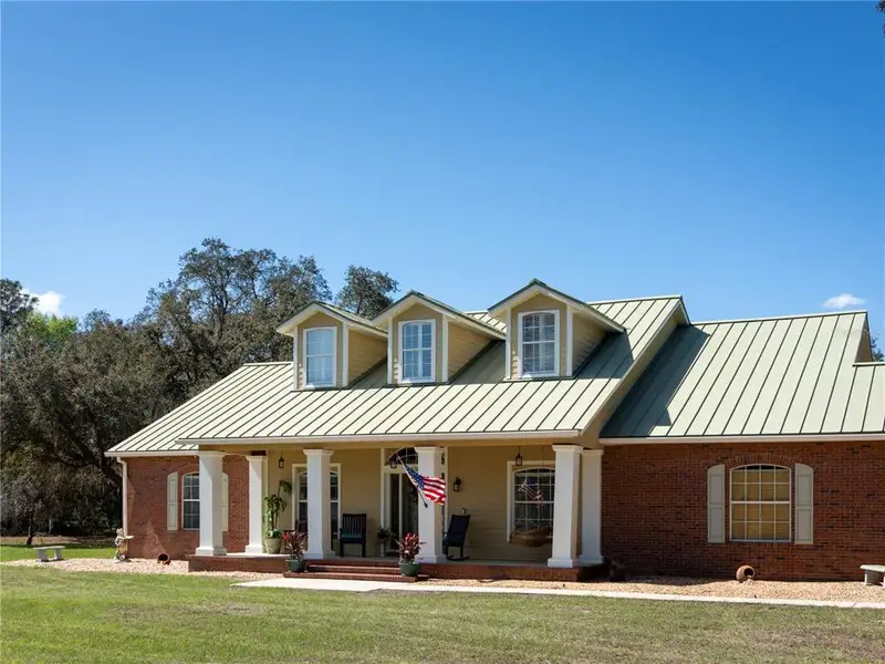 Front exterior of a new home in , Ocklawaha, FL, highlighting curb appeal (Image 21).