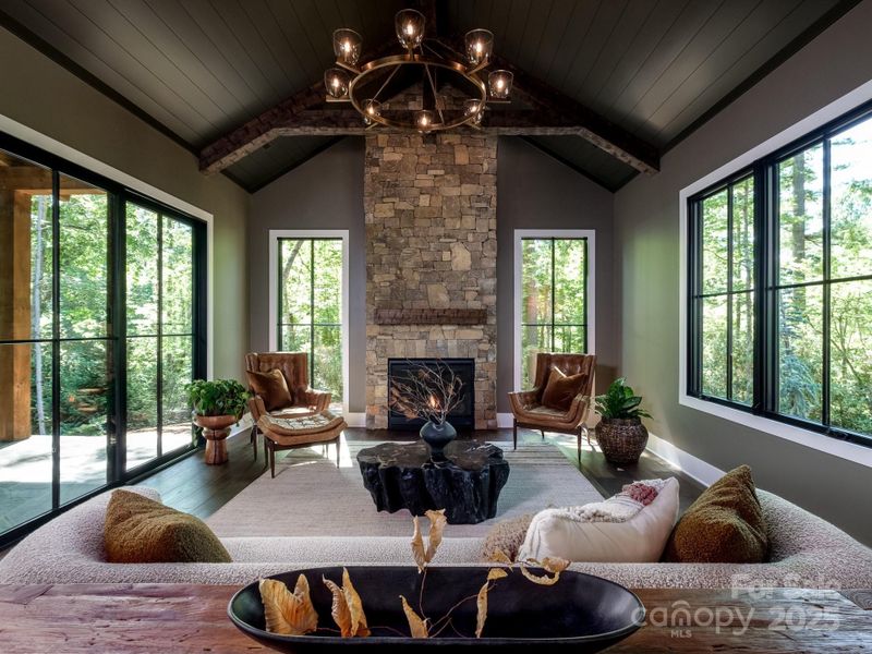 Great room surrounded by beautiful forest