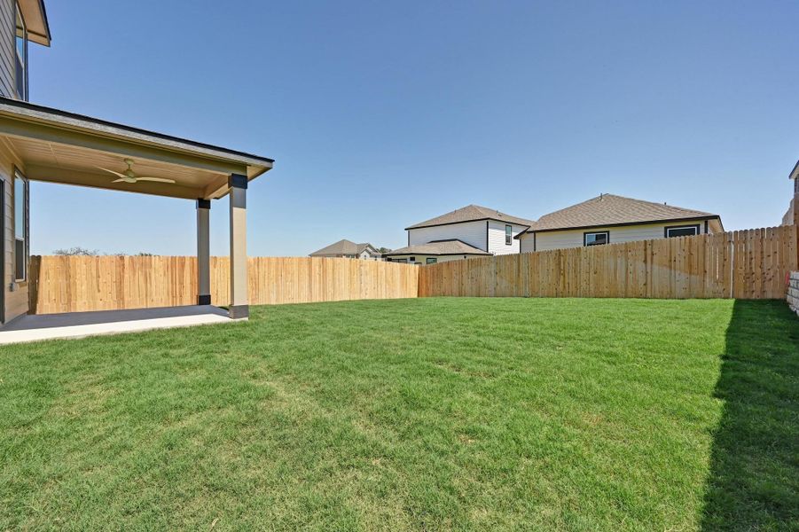 Exterior details and patio area of a home in Creekside at Estancia, Austin (Image 4).