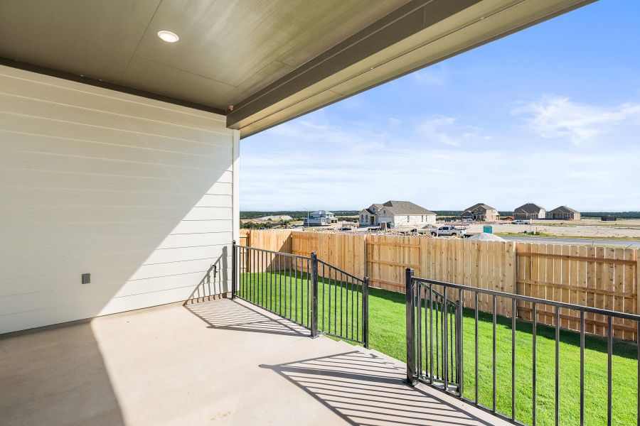 Exterior details and patio area of a home in Lariat, Liberty Hill (Image 20).