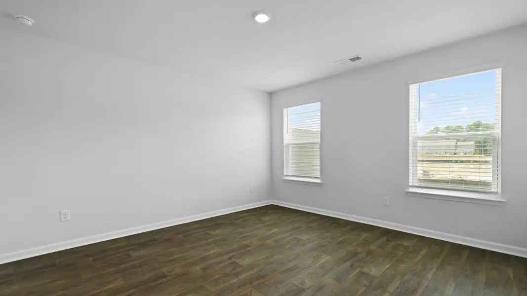 Spacious, unfurnished interior of a new home in Pine Hills Townhomes at Cane Bay, Summerville (Image 16). Spacious, unfurnished interior of a new home in Pine Hills Townhomes at Cane Bay, Summerville (Image 16).