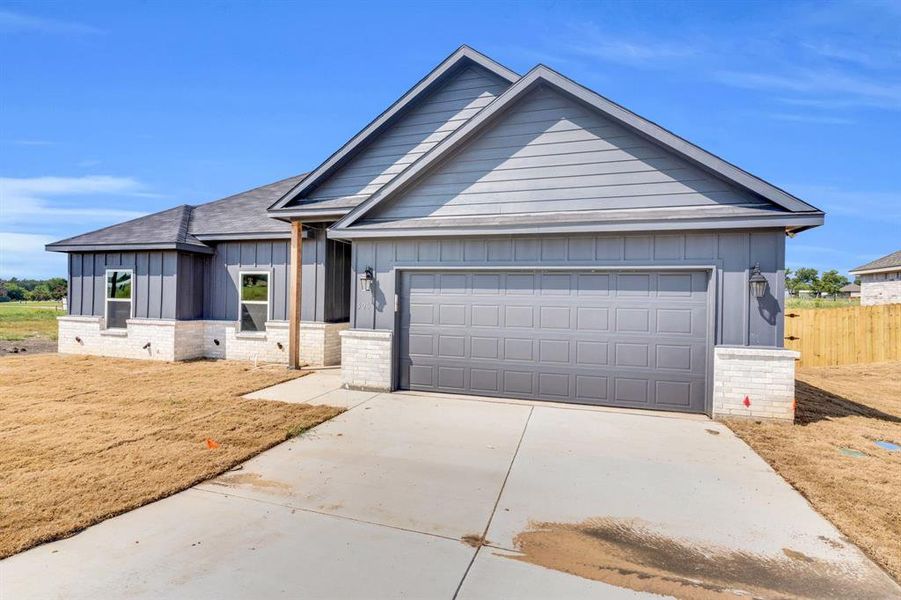 Front exterior of a new home in , Palmer, TX, highlighting curb appeal (Image 25). Front exterior of a new home in , Palmer, TX, highlighting curb appeal (Image 25).