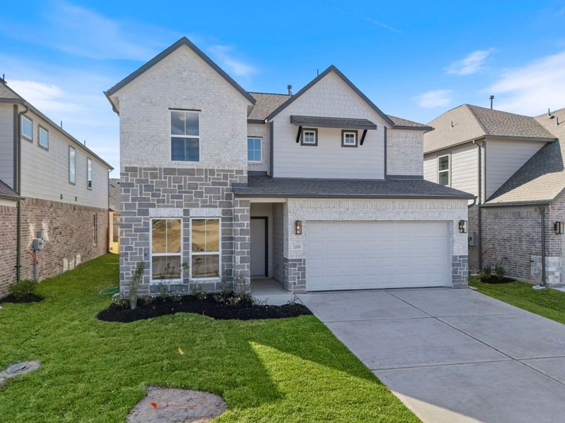 Front exterior of a new home in Barton Creek Ranch, Conroe, TX, highlighting curb appeal (Image 2).