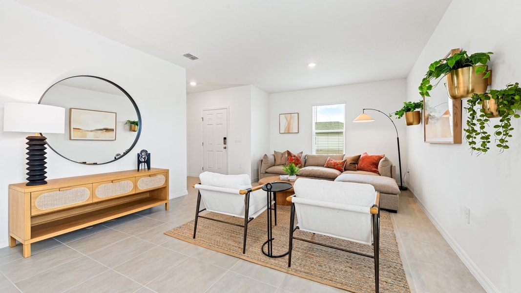 Representative furnished interior of a home built from the Seneca by Taylor Morrison in Palm Wind, Hudson (Image 8).