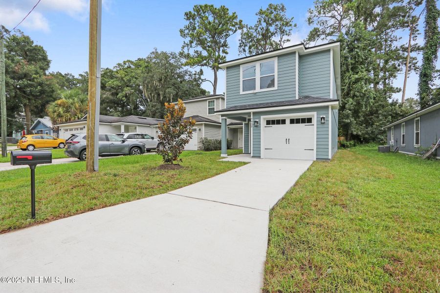 Front exterior of a new home in , Jacksonville, FL, highlighting curb appeal (Image 14).