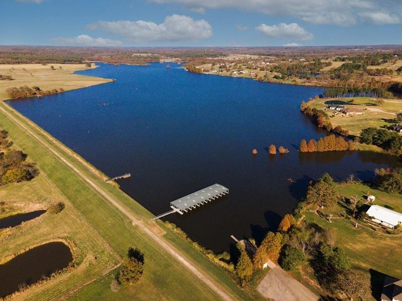Aerial view of property's location featuring a nearby body of water