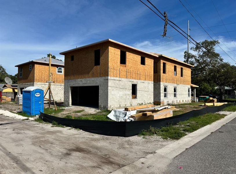 Front exterior of a new home in , St. Petersburg, FL, highlighting curb appeal (Image 13).