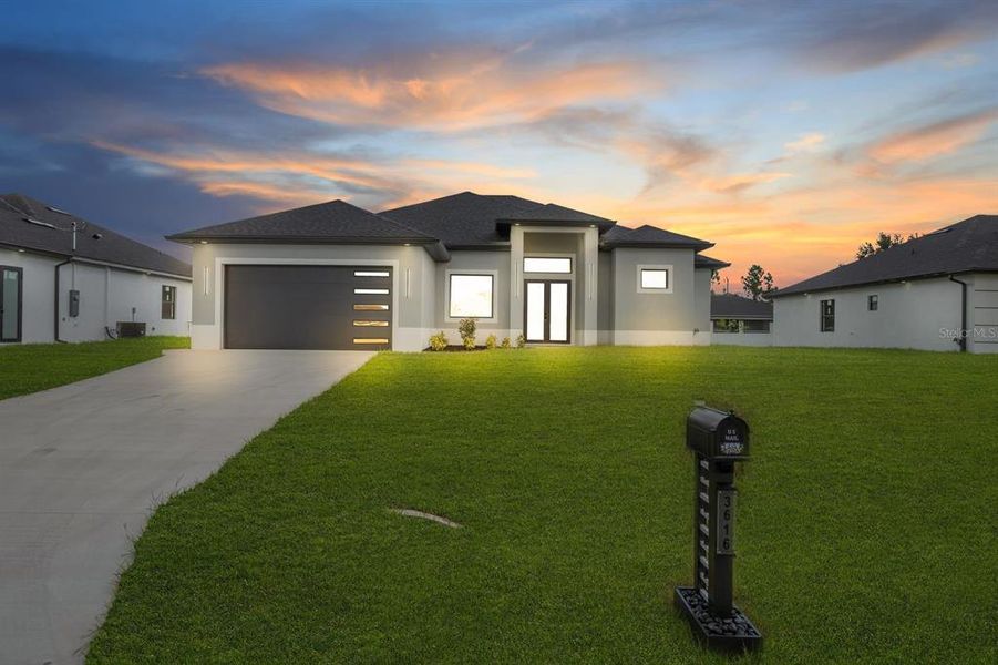 Front exterior of a new home in , Lehigh Acres, FL, highlighting curb appeal (Image 20).