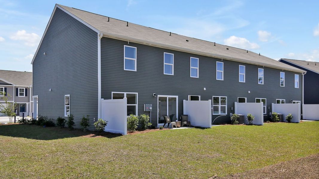 Representative exterior photo of a completed home built from the MITCHELL TOWNHOME by D.R. Horton in Grayson Park Townhomes, Leland, NC (Image 19). Representative exterior photo of a completed home built from the MITCHELL TOWNHOME by D.R. Horton in Grayson Park Townhomes, Leland, NC (Image 19).