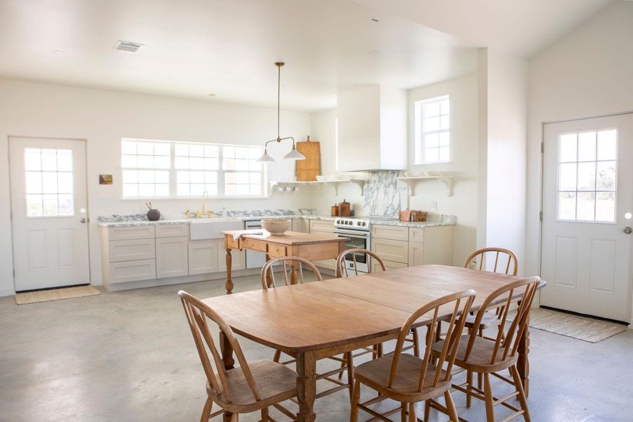 Dining space featuring concrete flooring Dining space featuring concrete flooring