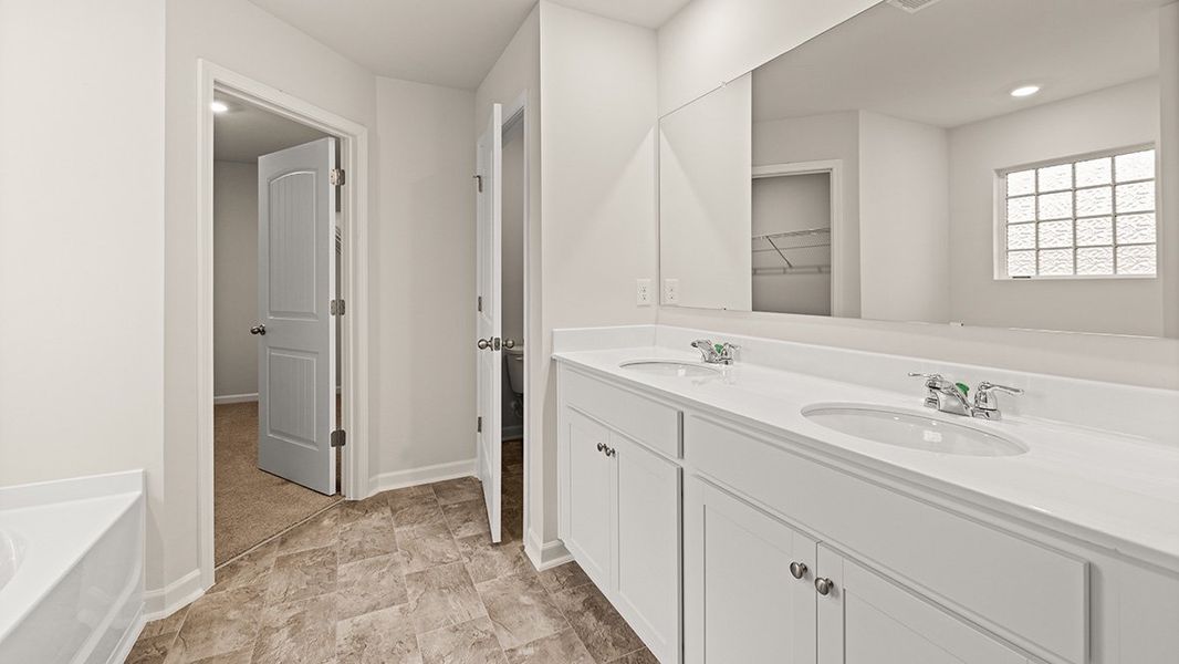 Representative furnished interior of a home built from the Mansfield by D.R. Horton in Northwoods at Mirror Lake, Villa Rica (Image 11).