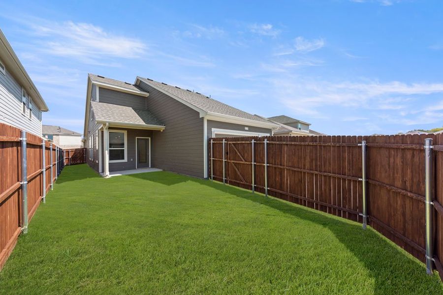 Front exterior of a new home in Heartland, Heartland, TX, highlighting curb appeal (Image 27). Front exterior of a new home in Heartland, Heartland, TX, highlighting curb appeal (Image 27).