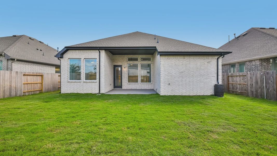 Exterior details and patio area of a home in Artavia, Conroe (Image 3).