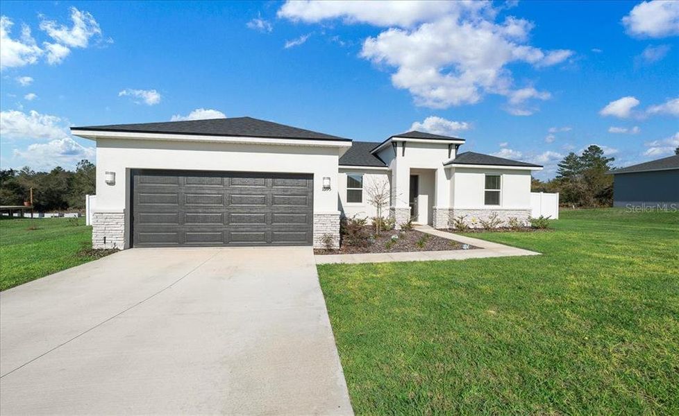 Front exterior of a new home in Ocala, Ocala, FL, highlighting curb appeal (Image 29).