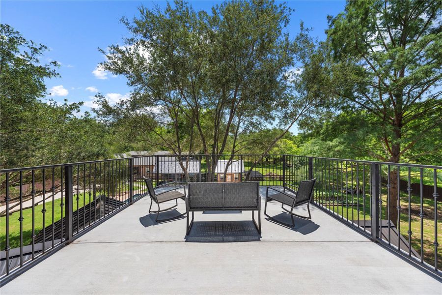 Expansive rooftop terrace offering peaceful treetop views and elevated outdoor lounging.