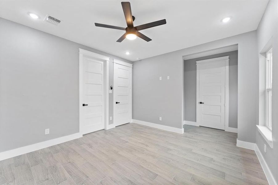 Primary bedrooms has a custom walk-in closet with built-in cabinetry.