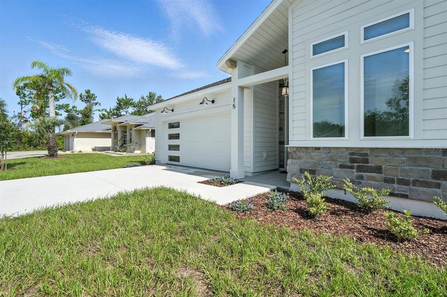 Exterior details and patio area of a home in Palm Coast Homes, Palm Coast (Image 3).