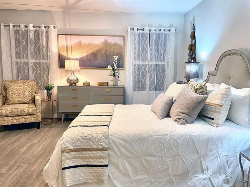 Bedroom with wood finished floors
