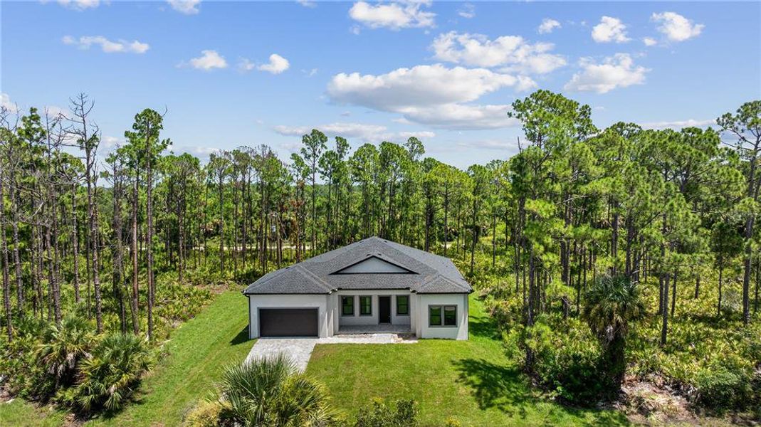 Front exterior of a new home in , Port Charlotte, FL, highlighting curb appeal (Image 33). Front exterior of a new home in , Port Charlotte, FL, highlighting curb appeal (Image 33).