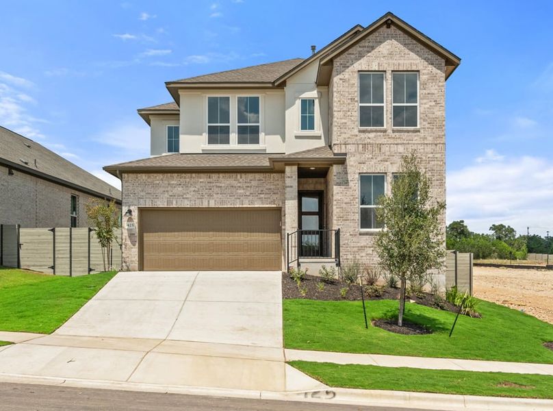 Front exterior of a new home in Arbor Collection At Wolf Ranch, Georgetown, TX, highlighting curb appeal (Image 2).