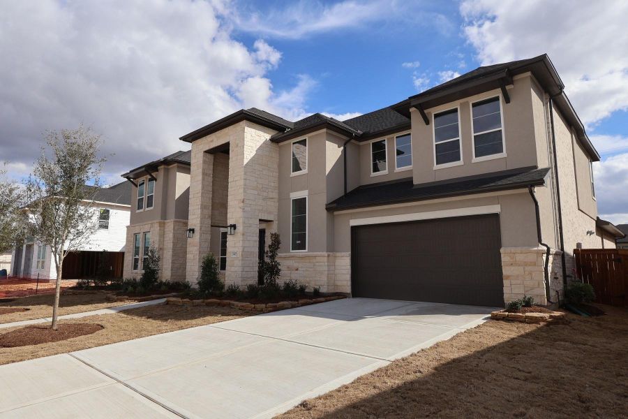 Front exterior of a new home in Dunham Pointe, Cypress, TX, highlighting curb appeal (Image 21).