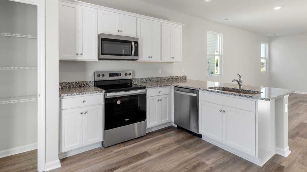Representative furnished interior of a home built from the DELANEY by D.R. Horton in The Cottages at Blake Farm, Wilmington (Image 14). Representative furnished interior of a home built from the DELANEY by D.R. Horton in The Cottages at Blake Farm, Wilmington (Image 14).
