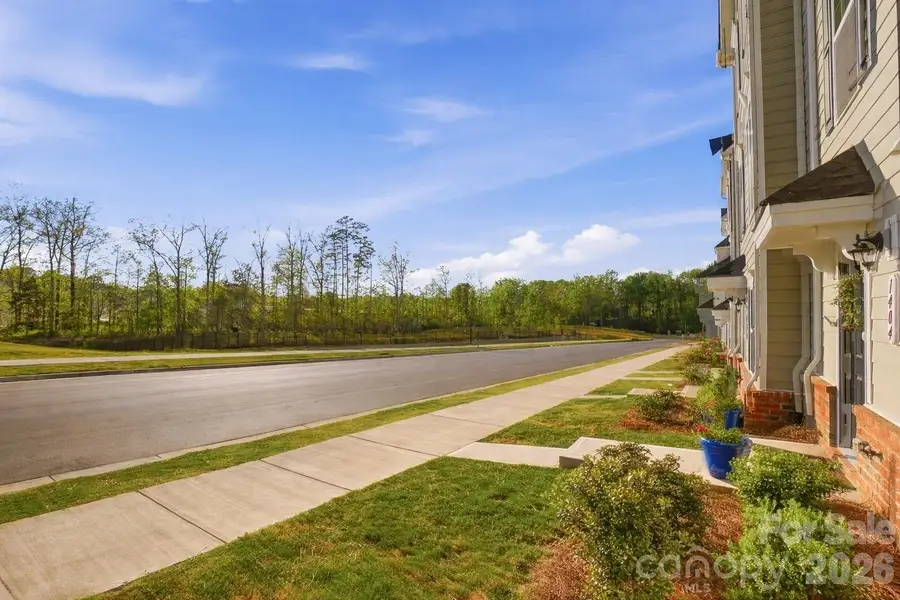 Exterior details and patio area of a home in Stone Creek Townhomes, Matthews (Image 20).