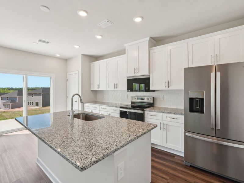 The oversized kitchen island makes meal-prep much easier.