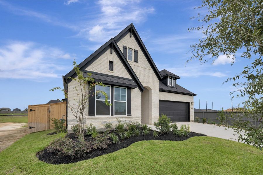 Front exterior of a new home in The Grand Prairie - Retreat Collection, Hockley, TX, highlighting curb appeal (Image 2). Front exterior of a new home in The Grand Prairie - Retreat Collection, Hockley, TX, highlighting curb appeal (Image 2).